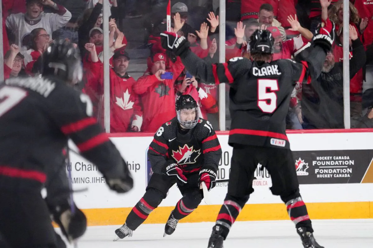 Canada's Connor Bedard, centre, reacts after scoring the game-winning goal in overtime of IIHF World Junior Hockey Championship quarterfinal action against Slovakia in Halifax, Jan. 2, 2023. (The Canadian Press/Darren Calabrese)