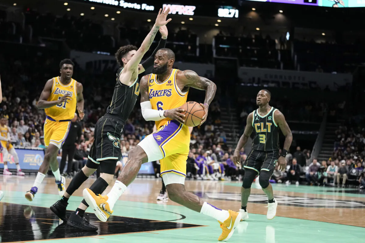 Los Angeles Lakers forward LeBron James drives to the basket past Charlotte Hornets guard LaMelo Ball during the first half of an NBA basketball game between the Charlotte Hornets and the Los Angeles Lakers on in Charlotte, on Jan. 2, 2023. (Chris Carlson/AP Photo)