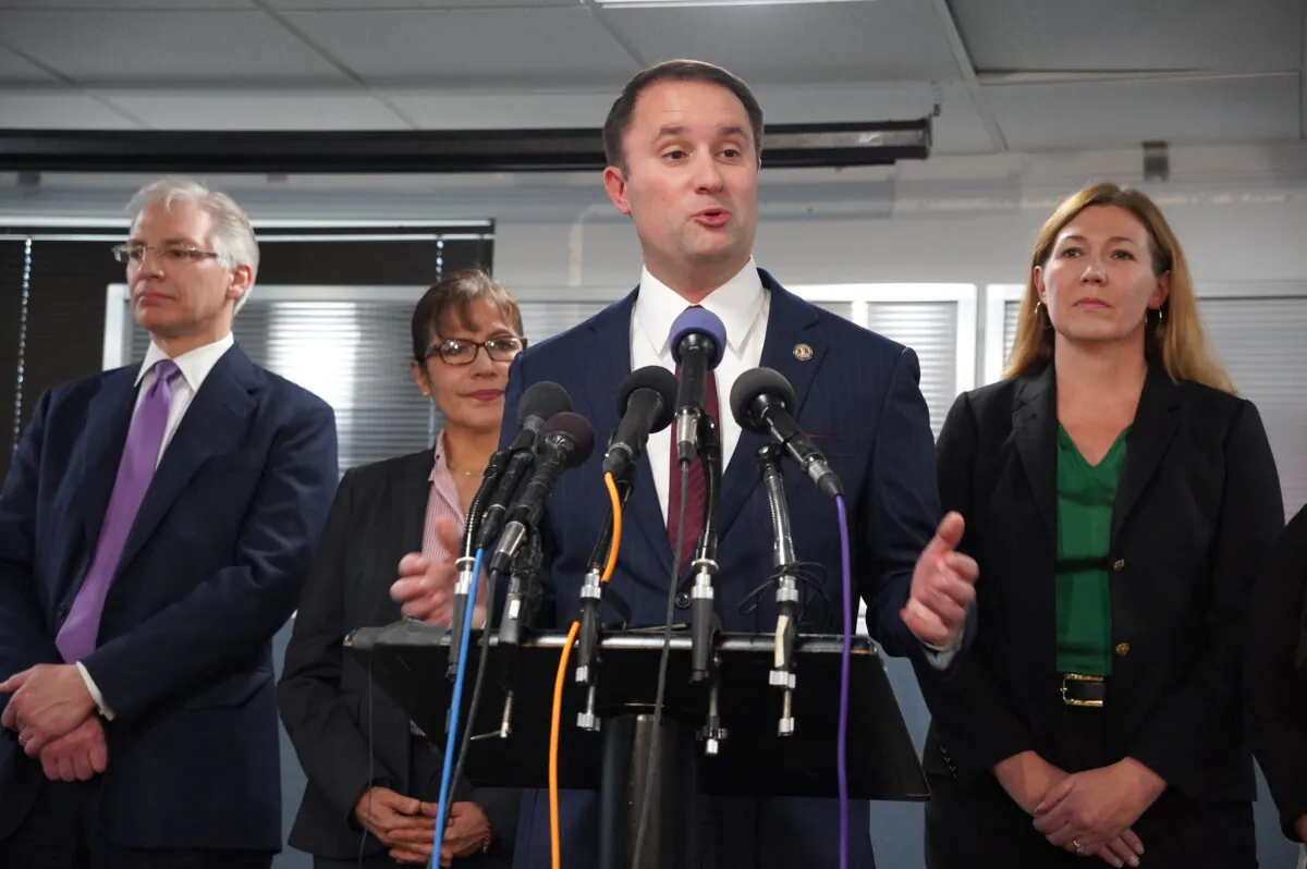 Virginia Attorney General Jason Miyares (C) announces investigations into Thomas Jefferson High School's delay in informing students of national merit awards and the school's admission policies in Alexandria, Va., on Jan. 4, 2023. (Terri Wu/The Epoch Times)