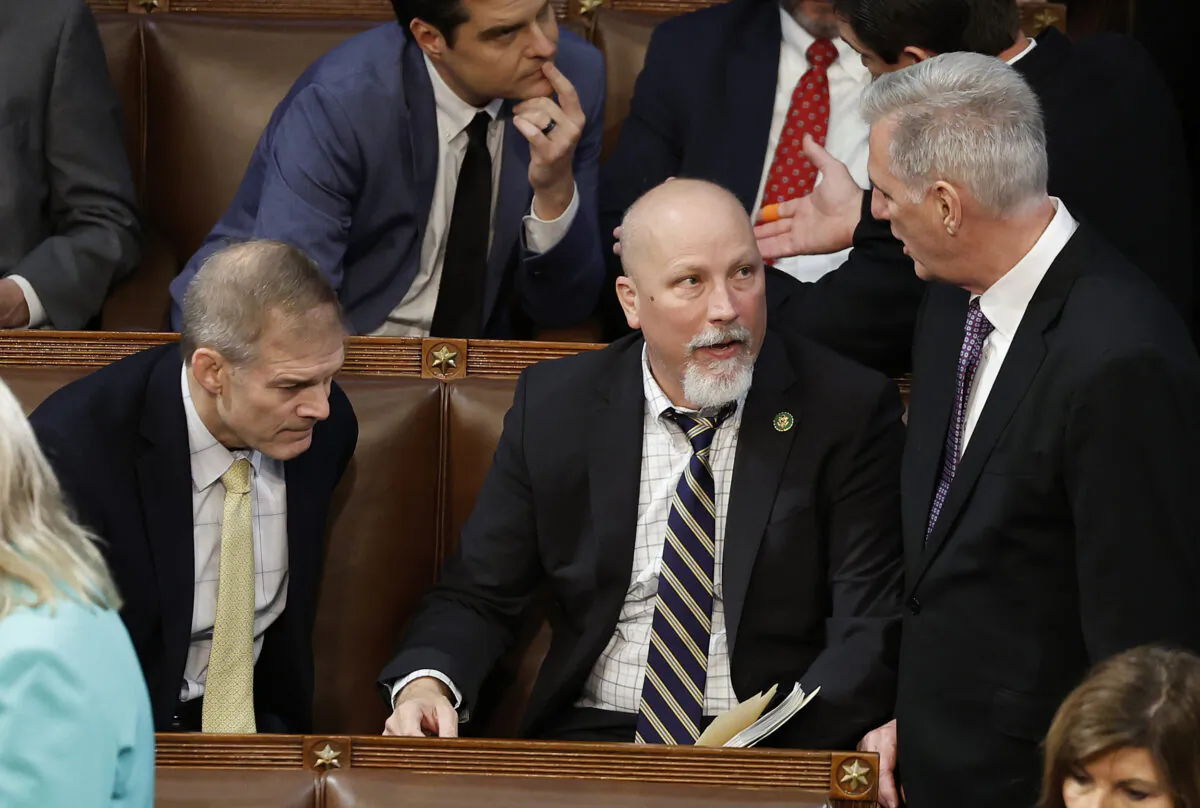House Republican Leader Kevin McCarthy (R-Calif.) (R) speaks with Rep.-elect Chip Roy (R-Texas) and Rep.-elect Jim Jordan (R-Ohio) (L) in the House Chamber during the second day of elections for Speaker of the House at the U.S. Capitol Building on Jan. 4, 2023. (Anna Moneymaker/Getty Images)