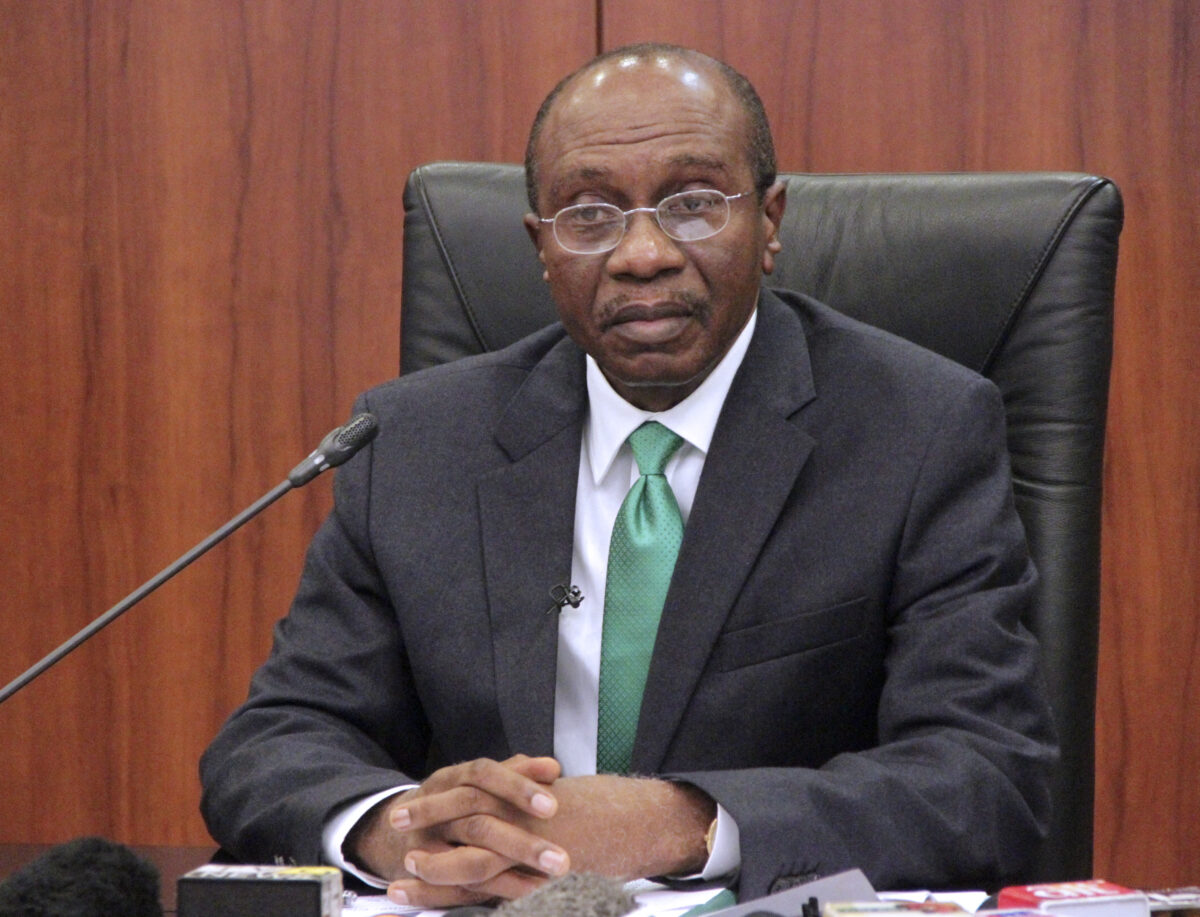 Central Bank of Nigeria's (CBN) governor Godwin Emefiele gives a press conference on the naira devaluation during a media briefing in Abuja on June 15, 2016. - Nigeria's central bank said today it will ease currency controls and allow the naira to devalue as the country works to attract investment amid a worsening economic outlook. Central Bank of Nigeria (CBN) governor Godwin Emefiele said in a televised speech from Abuja that the currency market will be 