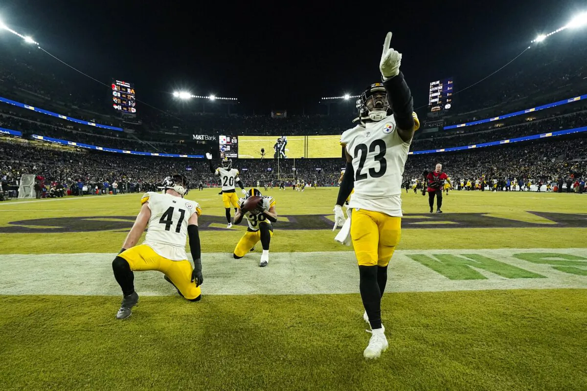 Pittsburgh Steelers safety Damontae Kazee (23) and linebacker Robert Spillane (41) celebrate an interception by safety Minkah Fitzpatrick (C) against the Baltimore Ravens in an NFL football game in Baltimore on Jan. 1, 2023. (Julio Cortez/AP Photo)