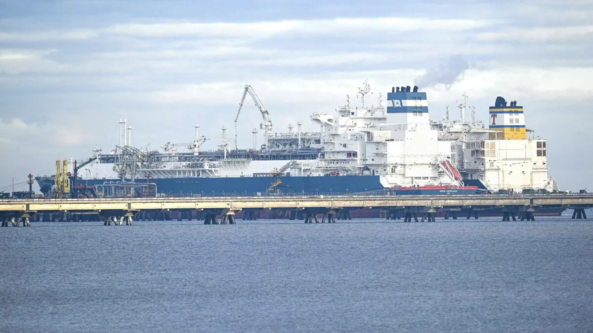 The tanker "Maria Energy", right, loaded with liquefied natural gas, lies at the floating terminal, the special ship "Hoegh Esperanza", in Wilhelmshaven, Germany, on Jan. 3, 2023. (Sina Schuldt/dpa via AP)
