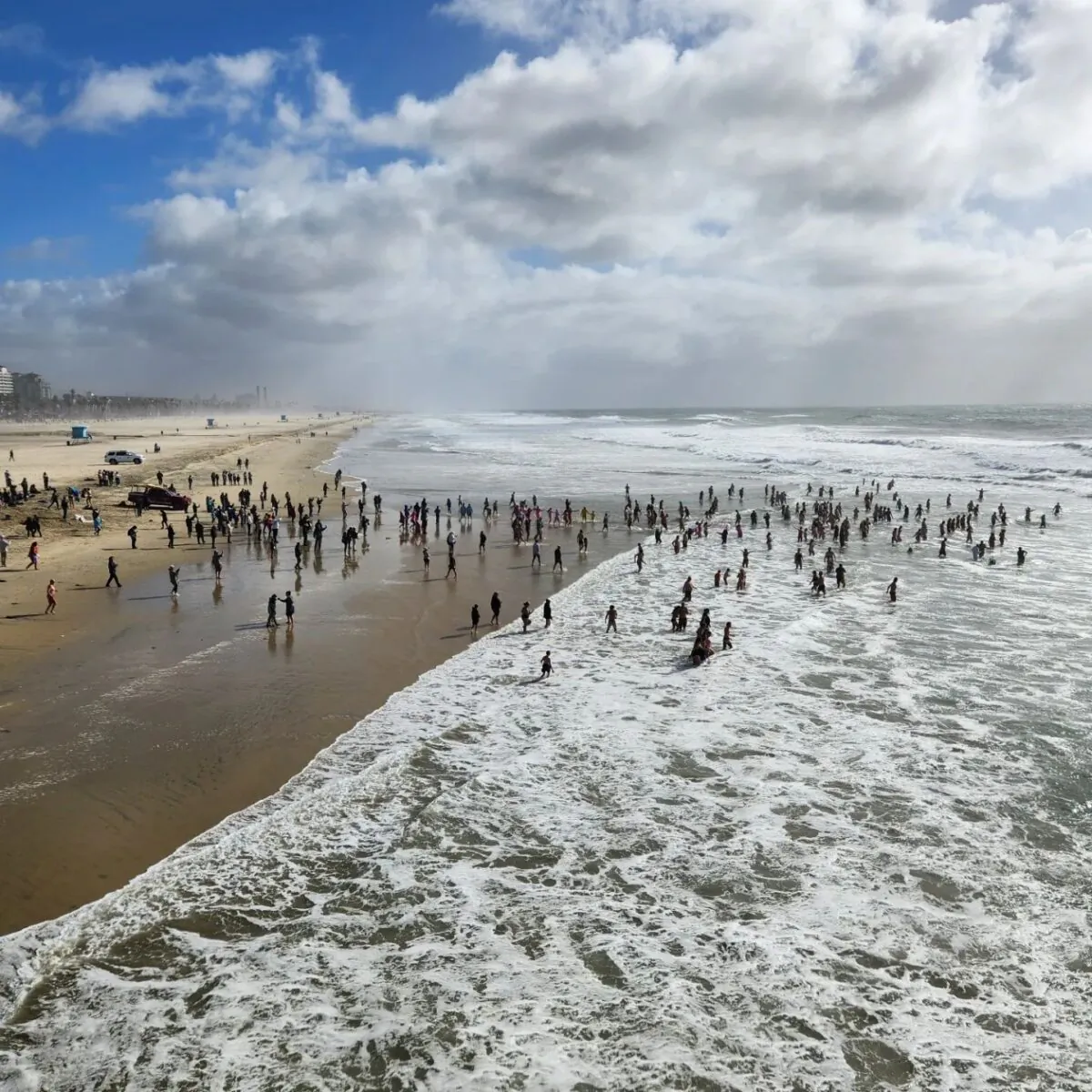 Hundreds partake in the 23rd Annual Surf City Splash in Huntington Beach, Calif., on Jan. 1, 2023. (Courtesy of the Surfrider Foundation)