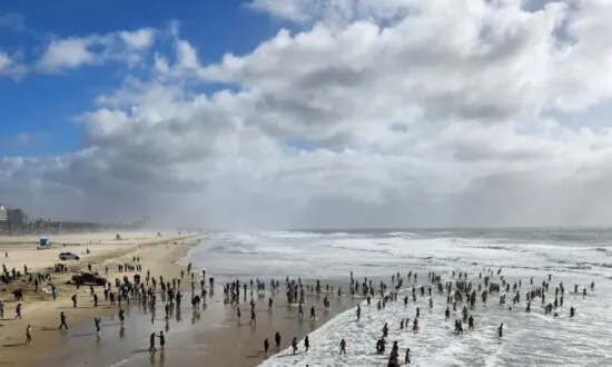 Hundreds Soak in the New Year at the Annual Surf City Splash