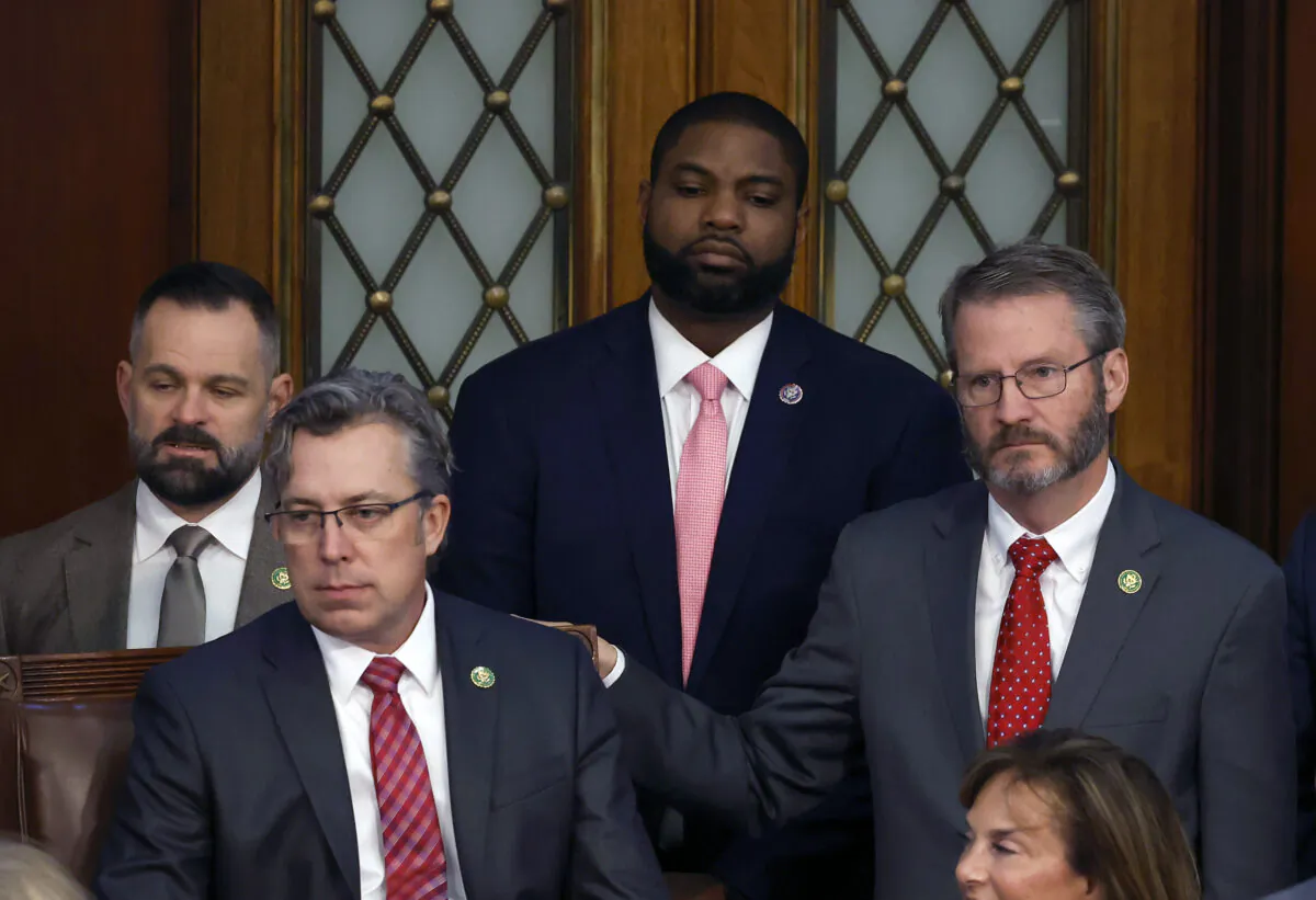 Rep. Byron Donalds (R-Fla.) (C), Rep. Andy Ogles (R-Tenn.) (L), and Rep. Tim Burchett (R-Tenn.) (R) watch proceedings in the House Chamber during the third day of elections for Speaker of the House at the U.S. Capitol Building in Washington on Jan. 5, 2023. (Chip Somodevilla/Getty Images)