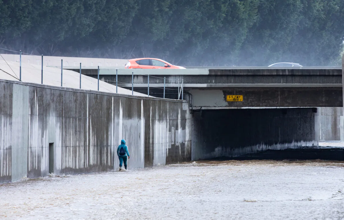 A bikepath fills with water during a storm in Irvine, Calif., on Jan. 5, 2023. (John Fredricks/The Epoch Times)