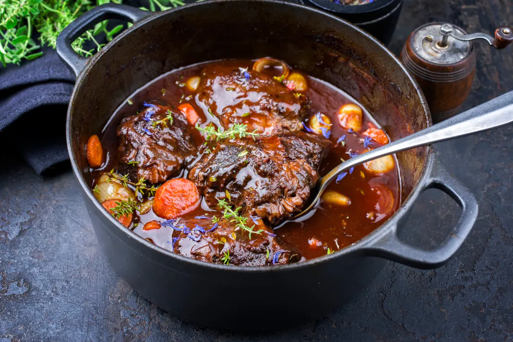While this meaty stew requires time and patience, it can be started a day early and chilled overnight to enhance its deep flavor. (hlphoto/Shutterstock)