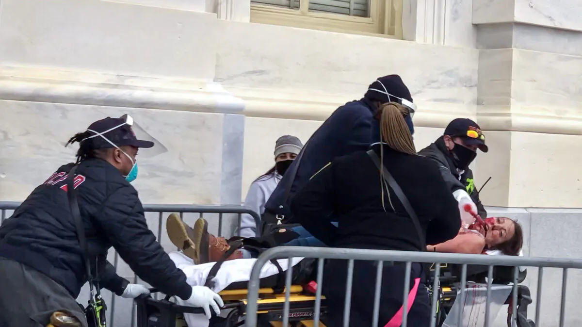 Paramedics from the D.C. Fire and EMS Department perform CPR on protester Ashli Babbitt, who was shot by police near the Speaker's Lobby on Jan. 6, 2021. (Courtesy of 
Steve Baker)