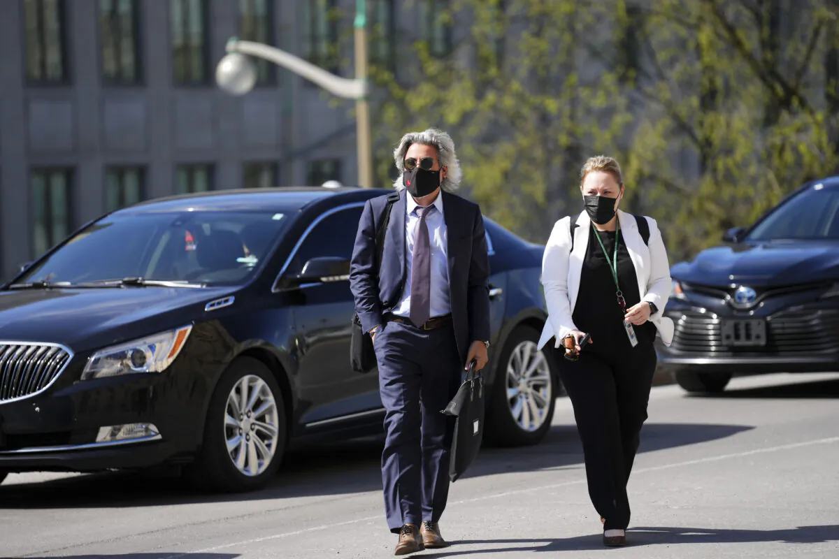 Minister of Canadian Heritage Pablo Rodriguez and a staff member arrive at a cabinet meeting on Parliament Hill in Ottawa. (The Canadian Press/Sean Kilpatrick)