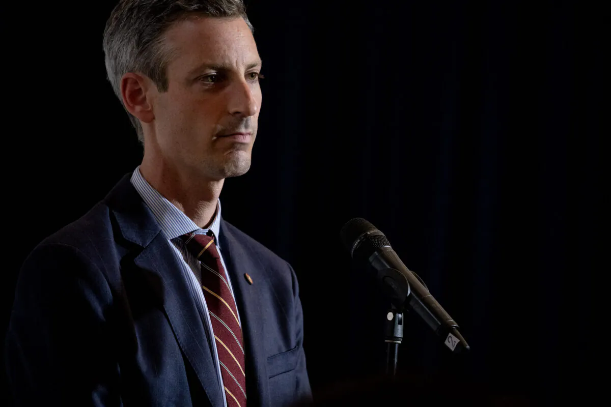 U.S. State Department spokesman Ned Price listens as U.S. Secretary of State Antony Blinken speaks during a press conference in Bangkok on July 10, 2022. (Stefani Reynolds/POOL/AFP via Getty Images)