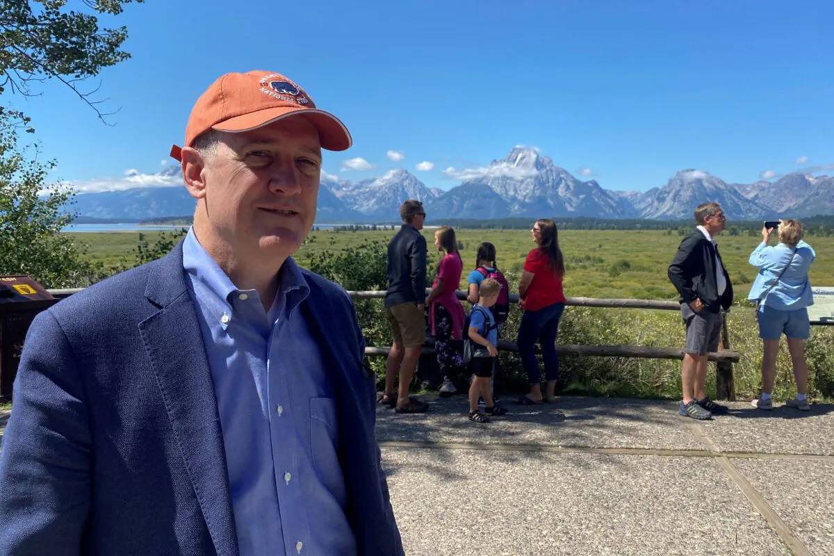 St. Louis Federal Reserve Bank President James Bullard stands with his back to the Teton mountain range outside the annual Kansas City Fed Economic Policy Symposium in Jackson Hole, Wyo., on Aug. 25, 2022. (Ann Saphir/Reuters)