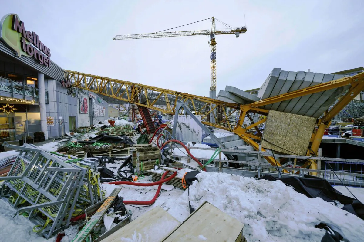 The scene after a construction crane fell over Melhustorget shopping mall, in Melhus, Norway, on Jan. 6, 2023. (Gorm Kallestad /NTB Scanpix via AP)
