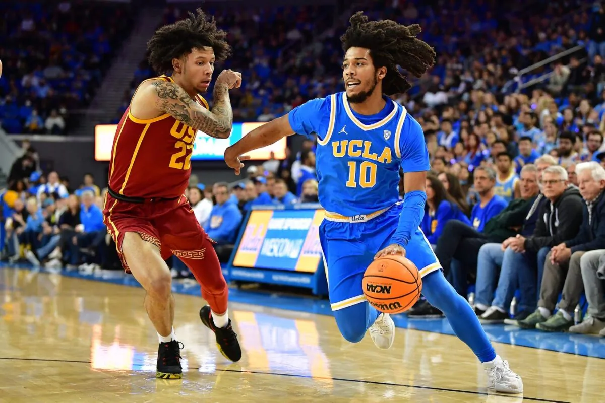 UCLA Bruins guard Tyger Campbell (10) moves the ball against Southern California Trojans guard Tre White (22) during the first half at Pauley Pavilion, in Los Angeles, on Jan. 5, 2023. (Gary A. Vasquez/USA TODAY Sports via Field Level Media)