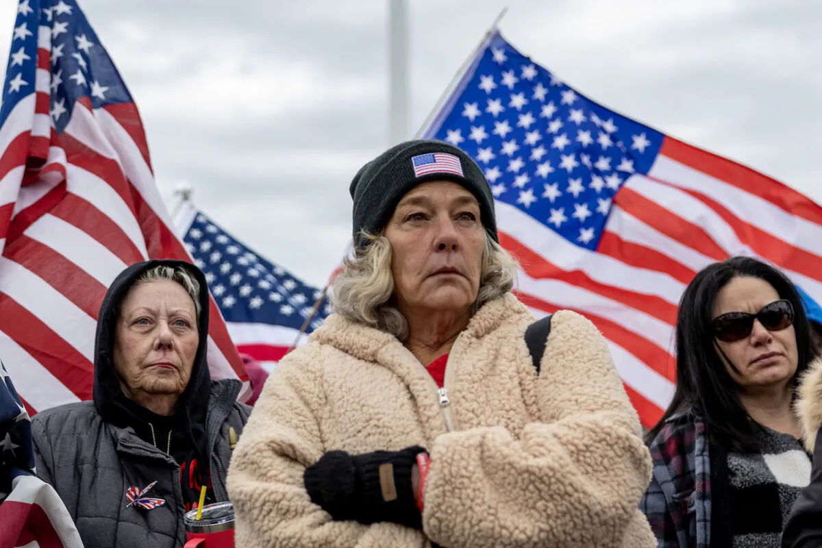 Micki Witthoeft (C), mother of Ashli Babbitt, who was killed on Jan. 6, 2021, stands with supporters of protesters that were arrested on Jan. 6, 2021, as they protest outside the U.S. Supreme Court on the second anniversary of the Jan. 6 breach of the U.S. Capitol, in Washington, on Jan. 6, 2023. (Tasos Katopodis/Getty Images)