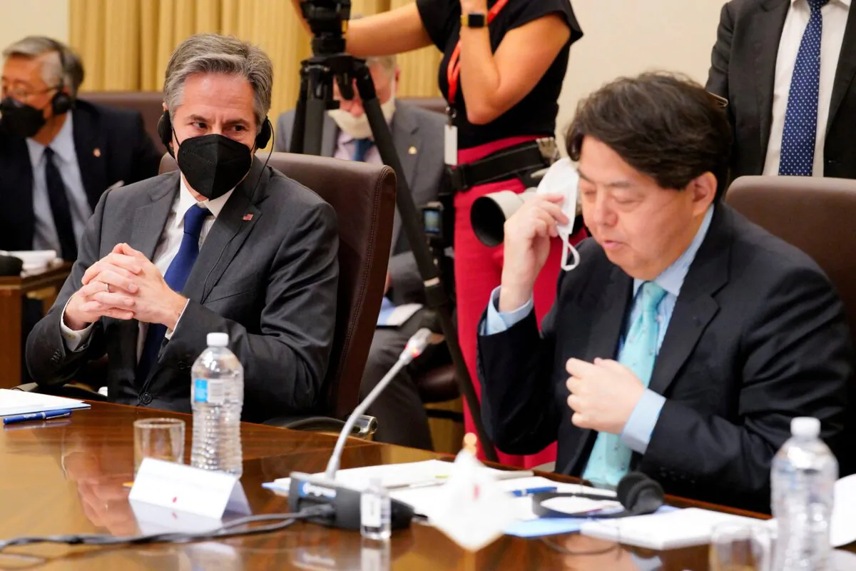 U.S. Secretary of State Antony Blinken (L) listens as Japan's Foreign Minister Yoshimasa Hayashi (R) makes opening remarks during a meeting of the Quadrilateral Security Dialogue (Quad) foreign ministers in Melbourne, Australia, on Feb. 11, 2022. (Sandra Sanders/POOL/AFP via Getty Images)