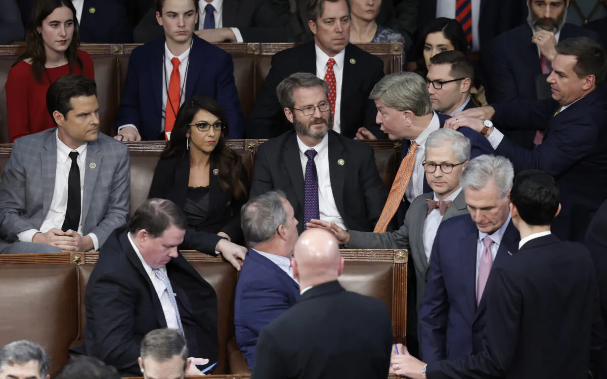 U.S. Rep. Mike Rogers (R-Ala.) is restrained by Rep. Richard Hudson (R-N.C.) after getting into an argument with Rep. Matt Gaetz (R-Fla.) as House Republican Leader Kevin McCarthy (R-Calif.) walks away, in the House Chamber during the 4th day of elections for House speaker at the U.S. Capitol Building on Jan. 6, 2023. (Anna Moneymaker/Getty Images)