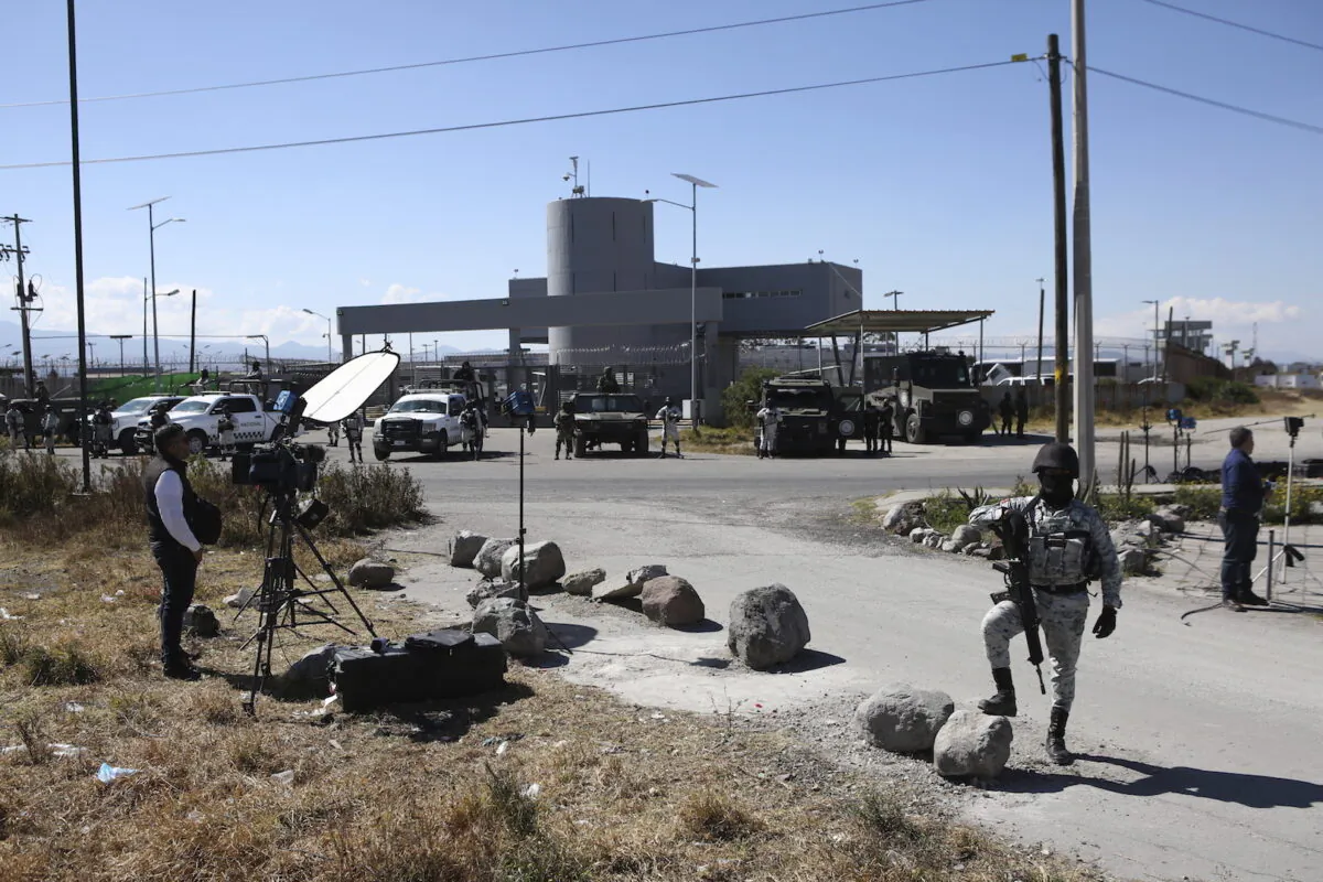 A Mexican National Guard stands guard outside the Almoloya prison where Ovidio Guzmán, the son of imprisoned drug lord Joaquin “El Chapo” Guzmán, is being held in Villa de Almoloya de Juarez, Mexico, on Jan. 6, 2023. (Ginnette Riquelme/AP Photo)