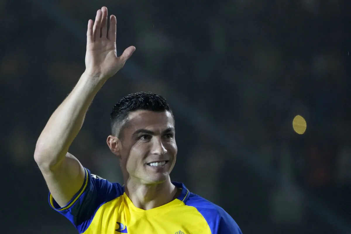 Cristiano Ronaldo greets Saudi fans during his official unveiling as a new member of Al Nassr soccer club in in Riyadh, Saudi Arabia, on Jan. 3, 2023. (Amr Nabil/AP Photo)