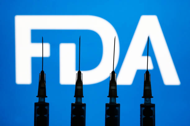 Medical syringes with the FDA logo displayed in the background in Krakow, Poland, on Dec. 2, 2021. (Jakub Porzycki/NurPhoto via Getty Images)