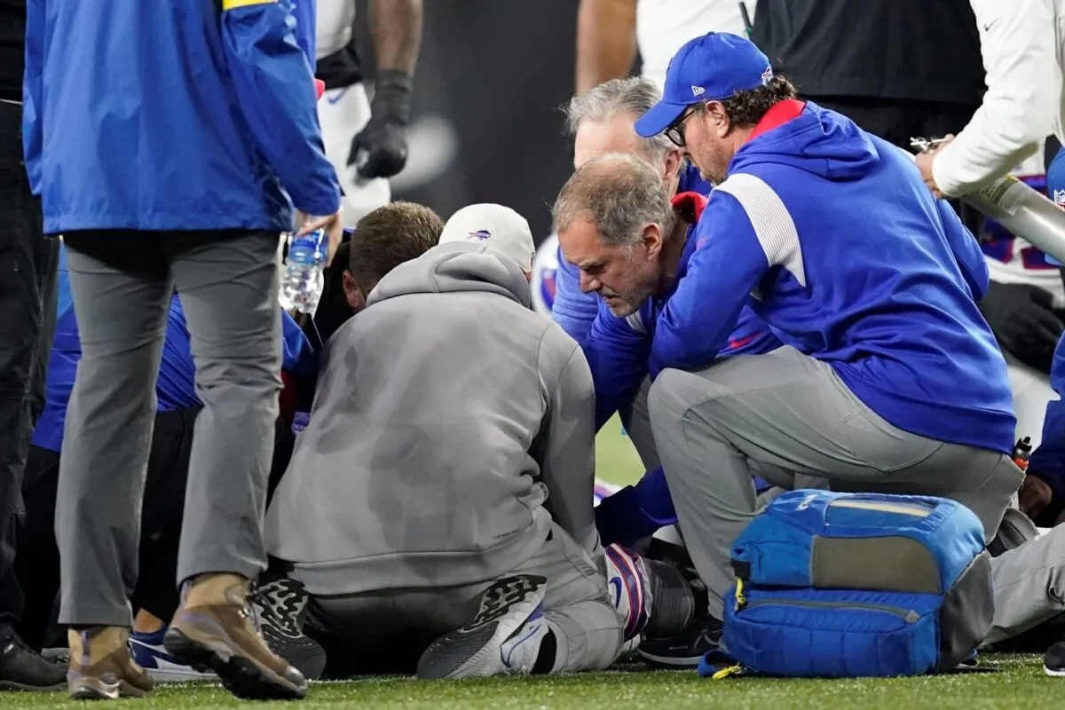 Buffalo Bills' Damar Hamlin is examined during the first half of an NFL football game against the Cincinnati Bengals, in Cincinnati  on Jan. 2, 2023. (Joshua A. Bickel/AP Photo)