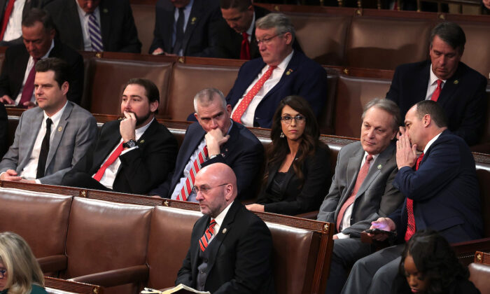 (L-R) Reps. Matt Gaetz (R-Fla.), Eli Crane (R-Ariz.), Matt Rosendale (R-Mont.), Lauren Boebert (R-Colo.), Andy Biggs (R-Ariz.), and Bob Good (R-Va.) sit together in the House Chamber during voting for Speaker of the House during the fourth day of elections at the U.S. Capitol Building in Washington, on Jan. 6, 2023. (Win McNamee/Getty Images)