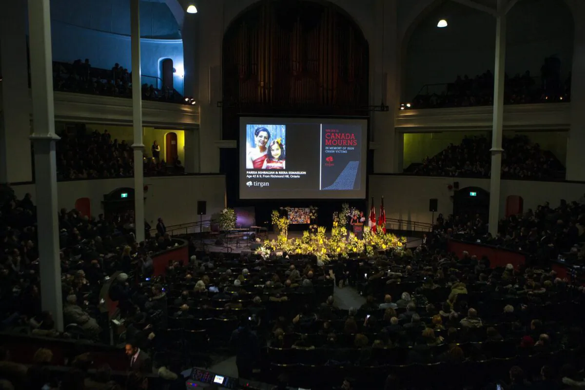 A photo of Parisa Eghbalian and Reera Esmaeilion, from Richmond Hill, Ont., is displayed on a screen during a memorial organized by the Iranian-Canadian charity Tirgan for the victims of the Iranian air crash, in Toronto, Jan. 12, 2020. (The Canadian Press/Chris Young)
