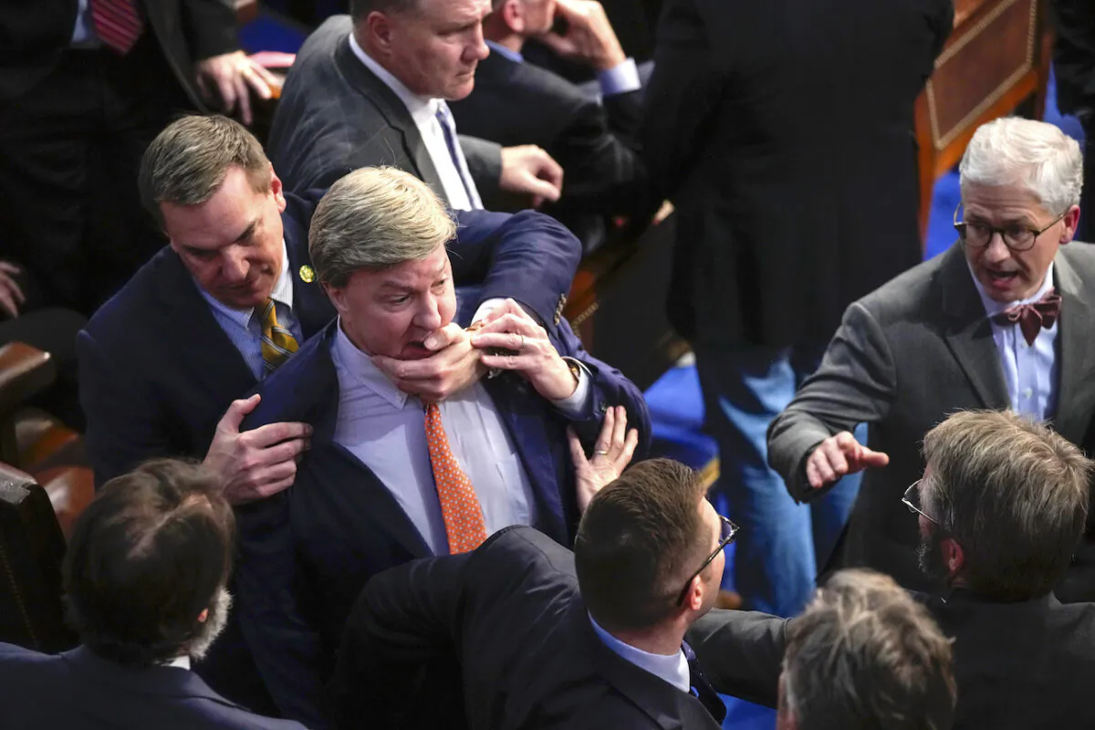 Rep. Richard Hudson (R-N.C.) (L), pulls Rep. Mike Rogers (R-Ala.) back as they talk with Rep. Matt Gaetz (R-Fla.) and others during the 14th round of voting for Speaker as the House on Jan. 6, 2023. (Andrew Harnik/AP Photo)