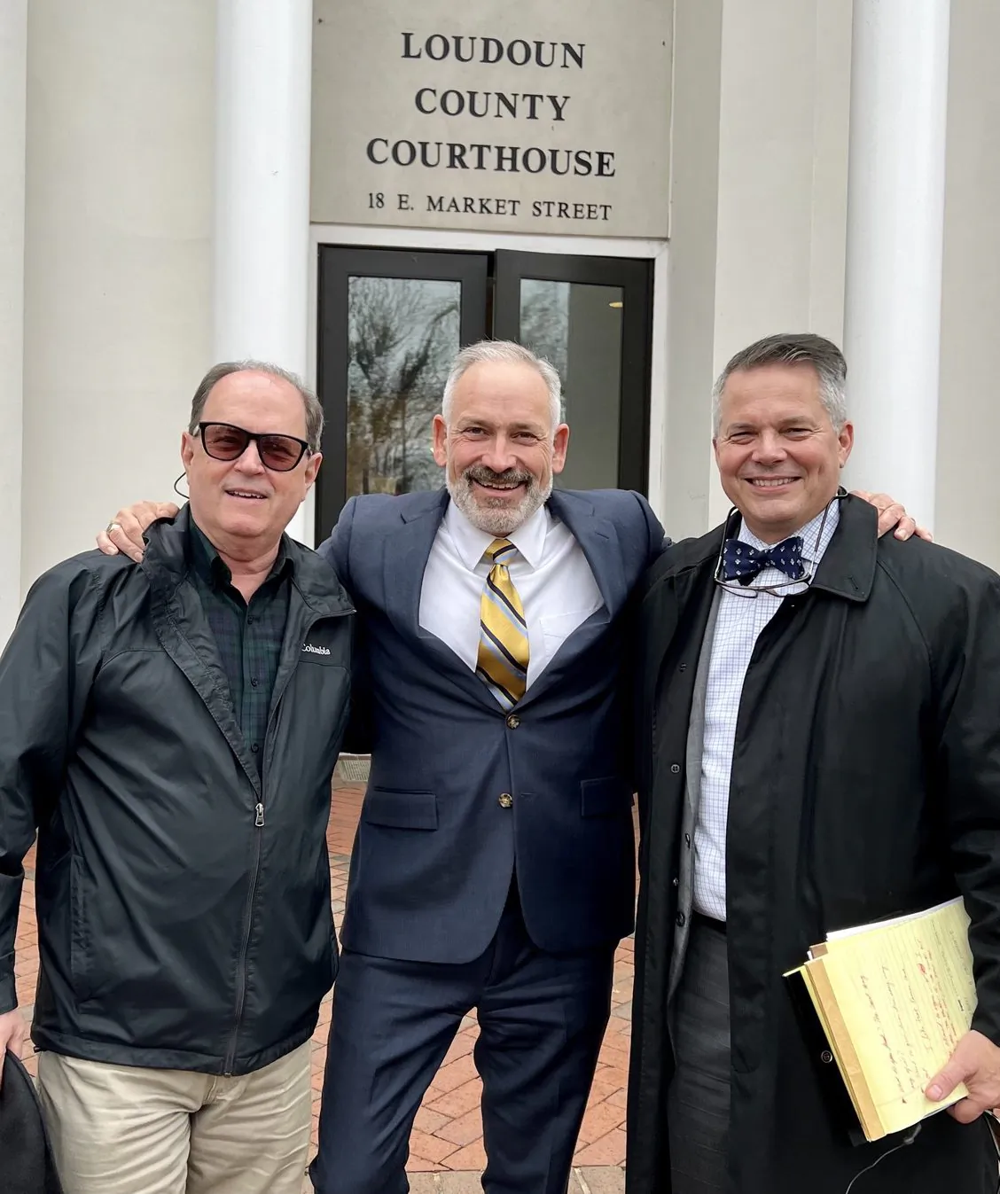 Jon Tigges (C), his attorney Chris Kachouroff (R), supporter Ralph Polachek outside the Loudoun County courthouse in Leesburg, Va., on Jan. 4, 2023. (Courtesy of Jon Tigges)