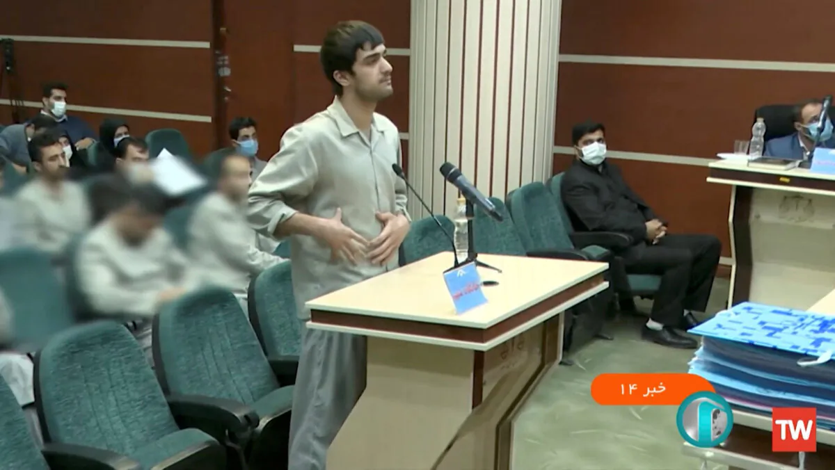 Mohammad-Mehdi Karami speaks in a courtroom in Tehran, Iran, in December 2022. (West Asia News Agency/Handout via Reuters)