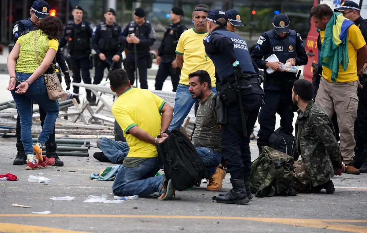 Security forces arrest rioters after retaking control of Planalto Presidential Palace in Brasilia on Jan. 8, 2023. (Ton Molina/AFP via Getty Images)