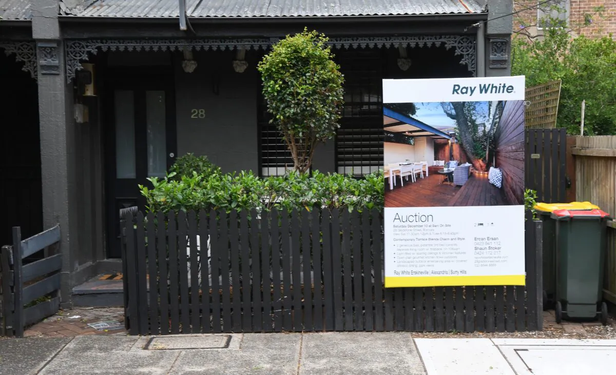 An advertising board for an upcoming house auction in Sydney, Australia, on Dec. 6, 2016. (William West/AFP via Getty Images)