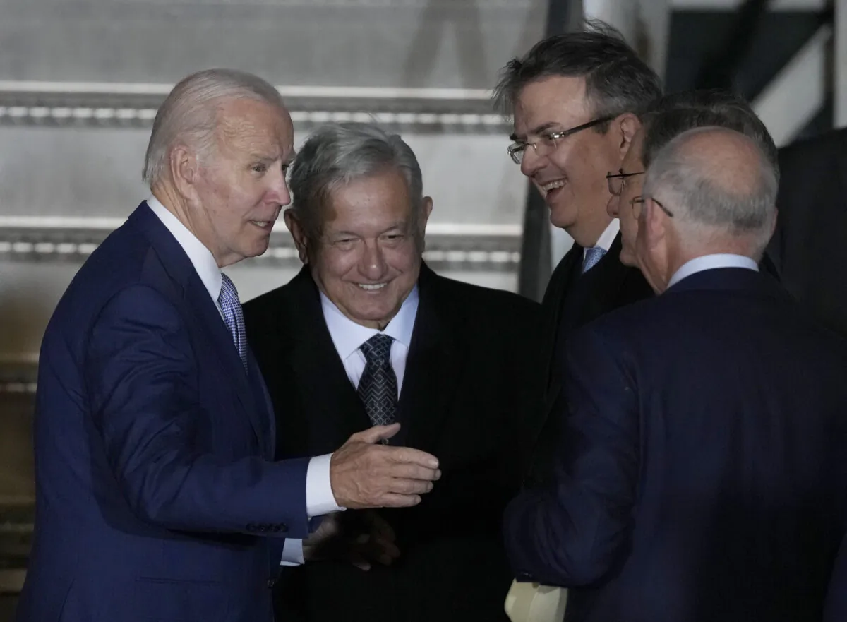 U.S. President Joe Biden is greeted at his arrival by Mexican President Andres Manuel Lopez Obrador, second left, Mexican Foreign Minister Marcelo Ebrard, second right, and U.S. Ambassador to Mexico Ken Salazar, right, at Biden's arrival to the Felipe Angeles international airport in Zumpango, Mexico, on Jan. 8, 2023. (Fernando Llano/AP Photo)