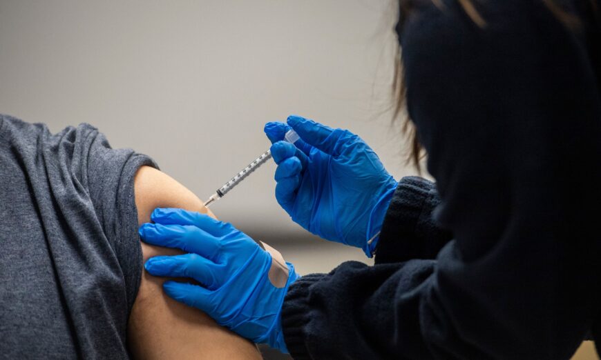 A man is given a COVID-19 vaccine at La Colaborativa in Chelsea, Mass., on Feb. 16, 2021. (Joseph Prezioso/AFP via Getty Images)