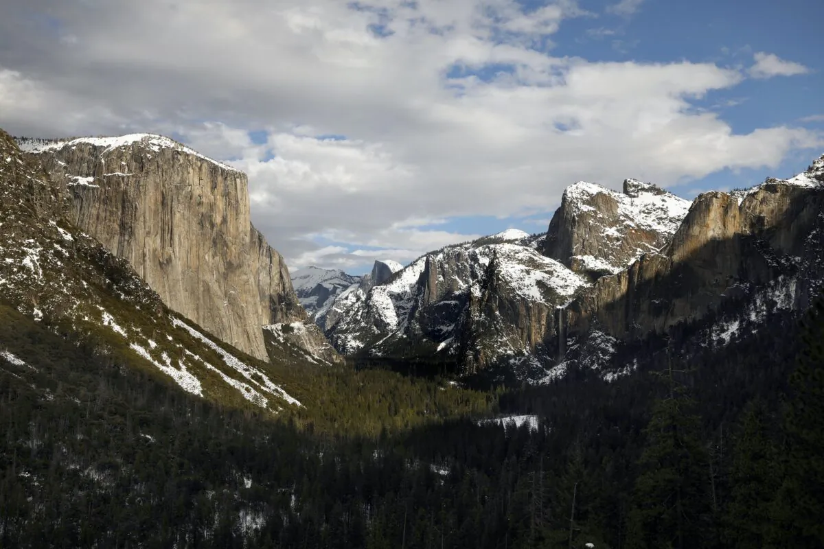 El Capitan and Cathedral Rocks, dusted with snow, are seen from Tunnel View on Feb. 1, 2021, at California's Yosemite National Park, which is one of about 100 national parks coast to coast that charge an entrance fee. (Carolyn Cole/Los Angeles Times/TNS)
