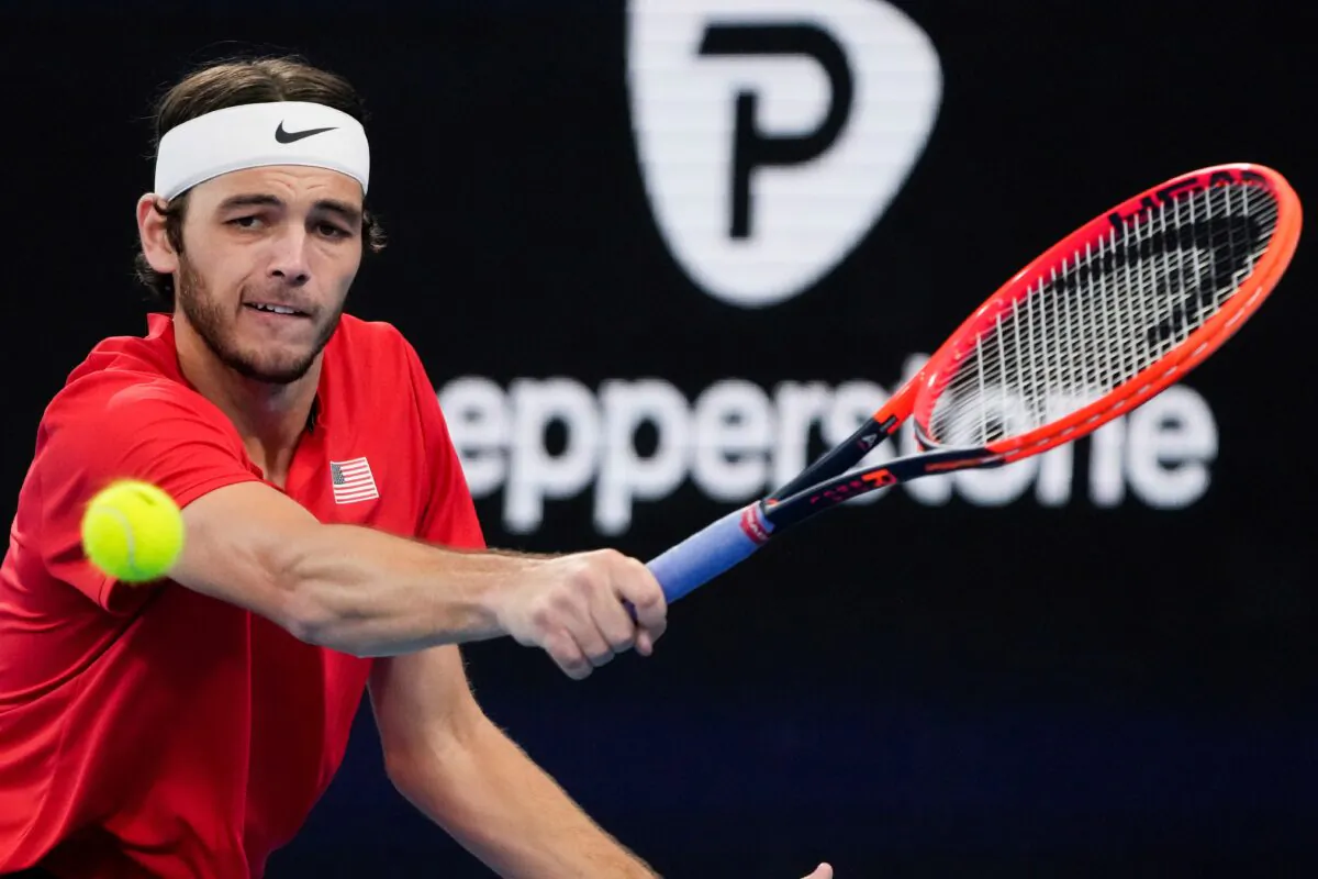 United States' Taylor Fritz plays a backhand return to Italy's Matteo Berrettini during the final of the United Cup tennis event in Sydney on Jan. 8, 2023. (Mark Baker/AP Photo)