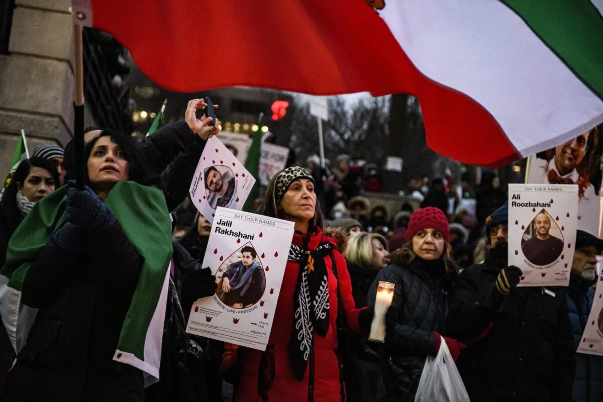 People attend a vigil marking the three year anniversary of the downing of flight PS752, in Toronto on Jan. 8, 2023. (The Canadian Press/Christopher Katsarov)