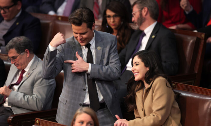 U.S. Rep.-elect Matt Gaetz (R-Fla.) flexes his arm alongside Rep.-elect Anna Paulina Luna (R-Fla.) after getting into an argument with Rep.-elect Mike Rogers (R-Ala.) in the House Chamber during the fourth day of elections for Speaker of the House at the U.S. Capitol Building in Washington, D.C., on Jan. 6, 2023. (Win McNamee/Getty Images)