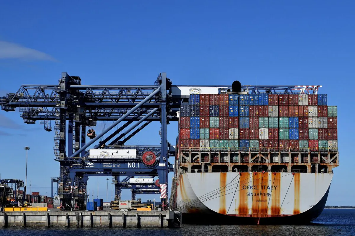 Containers are loaded onto a cargo ship at Port Botany in Sydney, Australia, on June 4, 2021. (Saeed Khan/AFP via Getty Images)