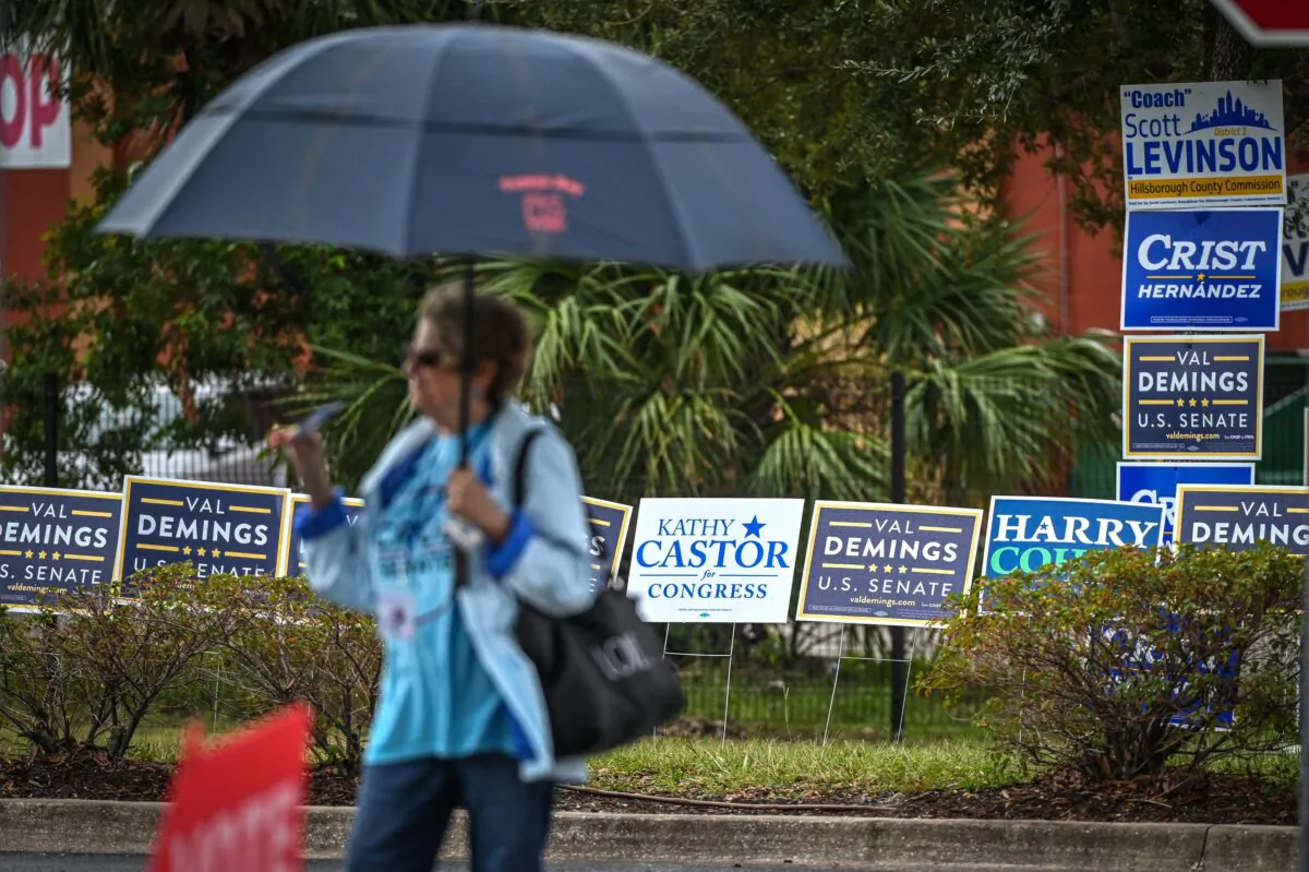 A person stands outside a polling site during the U.S. midterm election in St. Petersburg, Florida, on Nov. 8, 2022. (Giorgio Viera/AFP via Getty Images)