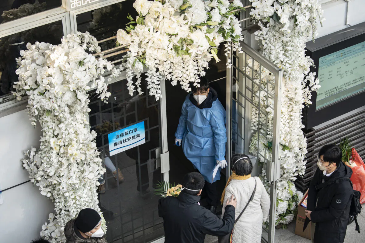 Mourners gather outside memorial halls for the deceased at a funeral home in Shanghai on Dec. 31, 2022. (Qilai Shen/Bloomberg via Getty Images)