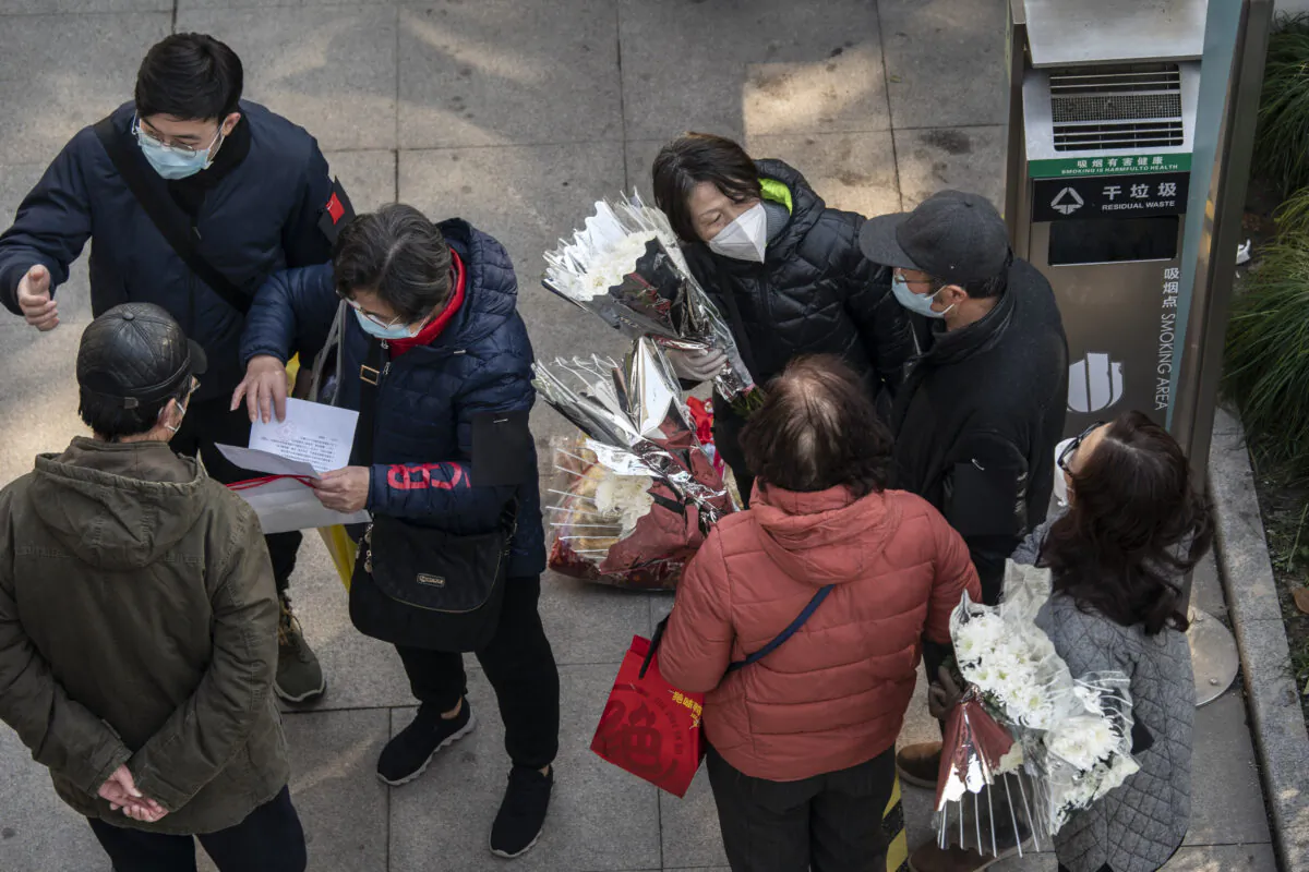 Mourners gather outside the memorial hall for the deceased at a funeral home in Shanghai, China, on Dec. 31, 2022. (Qilai Shen/Bloomberg via Getty Images)