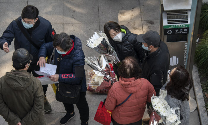 Mourners gather outside the memorial halls for the deceased at a funeral home in Shanghai, China, on Dec. 31, 2022. (Qilai Shen/Bloomberg via Getty Images)