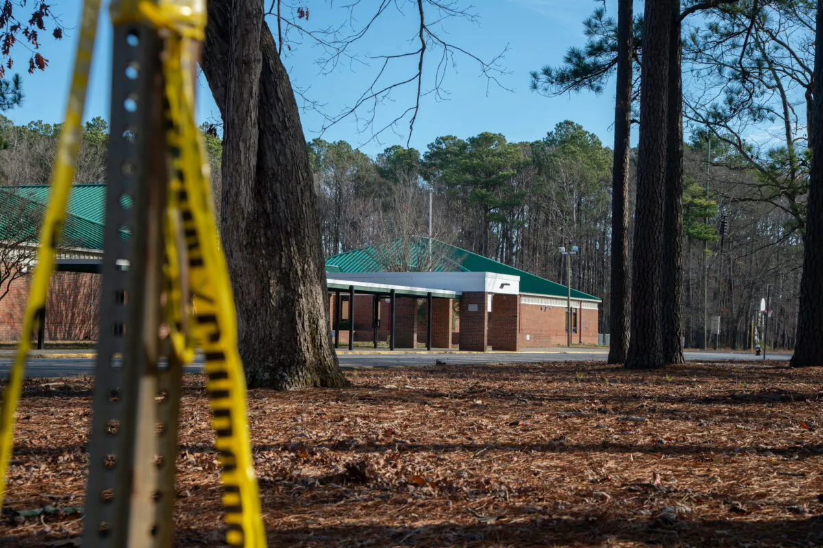 Police tape hangs from a sign post outside Richneck Elementary School following a shooting in Newport News, Va., on Jan. 7, 2023. (Jay Paul/Getty Images)