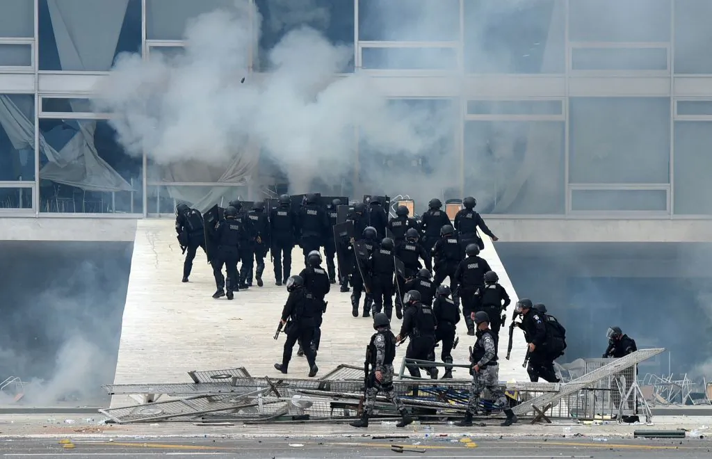 Security forces confront supporters of Brazil's former President Jair Bolsonaro who invaded Planalto Presidential Palace in Brasília on Jan. 8, 2023. Hundreds of rioters stormed into the National Congress building, the presidential palace, and the Supreme Court in a dramatic protest against President Luiz Inácio Lula da Silva's inauguration. (Ton Molina/AFP via Getty Images)