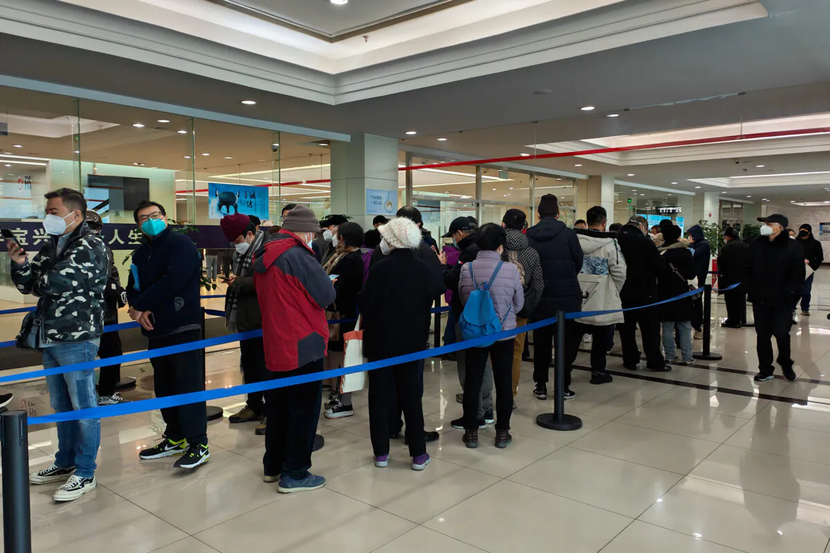 People wait for funeral service for their deceased relatives at Baoxing Funeral Parlor in Shanghai, China, on Jan. 4, 2023. (Wang Gang/VCG via Getty Images)