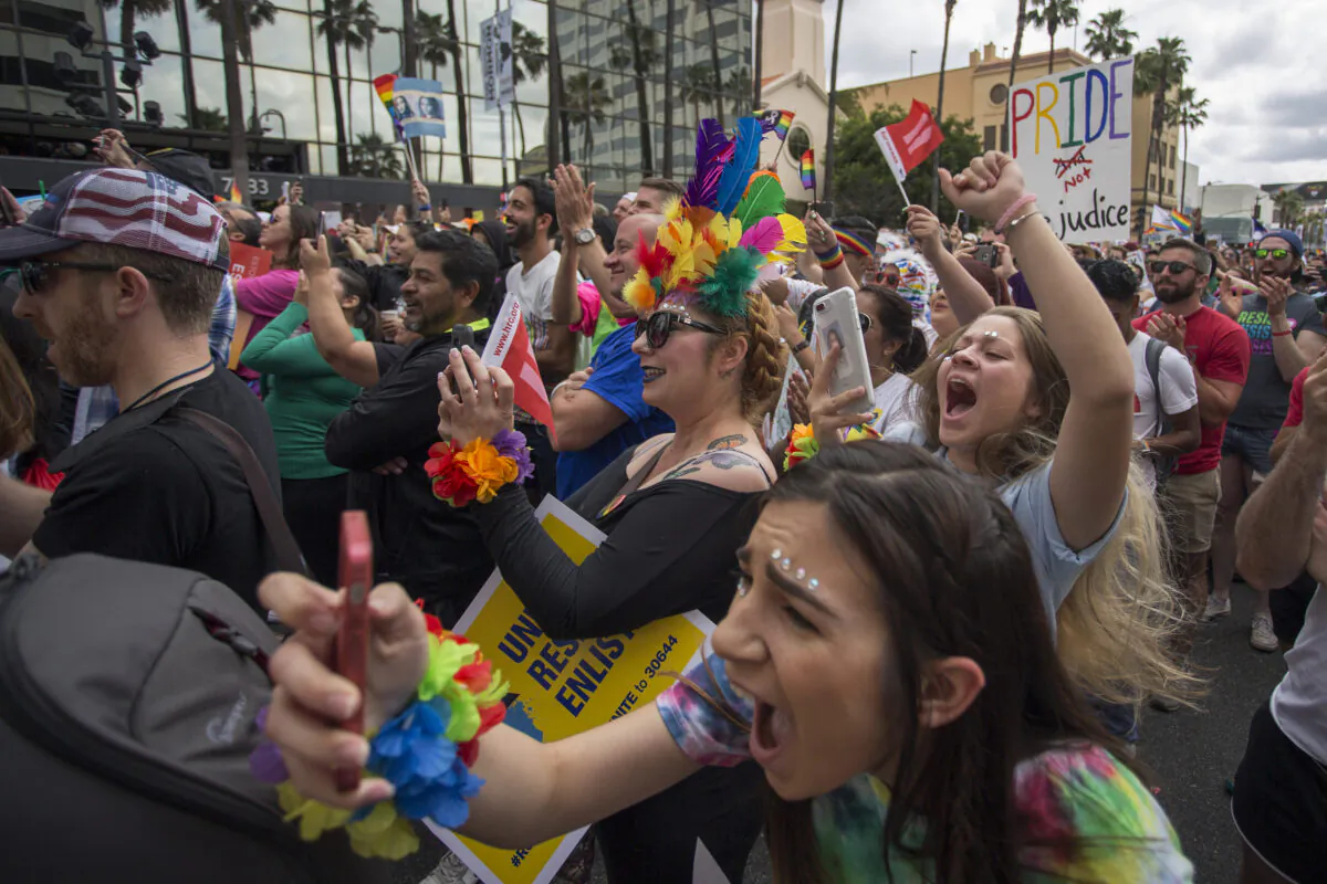 Crowd reacts to actor and drag queen RuPaul speaking at the #ResistMarch during the 47th annual LA Pride Festival in the Hollywood section of Los Angeles and West Hollywood, Calif., on June 11, 2017. (David McNew/Getty Images)