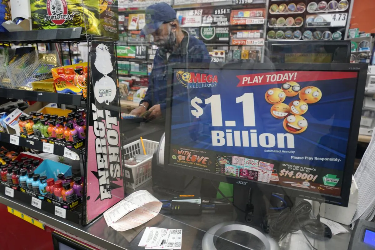 A Mega Million sign displays the estimated jackpot of $1.1 Billion at the Fuel On Convenience store in Pittsburgh on Jan. 9, 2023. (Gene J. Puskar/AP Photo)