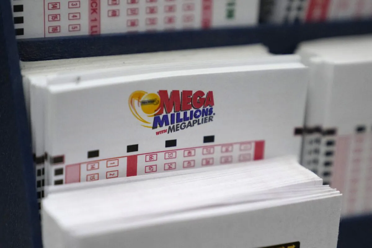 A display holds Mega Million lottery ticket wagering cards at Ted's State Line Mobil station in Methuen, Mass., on Jan. 5, 2023. (Charles Krupa/AP Photo)