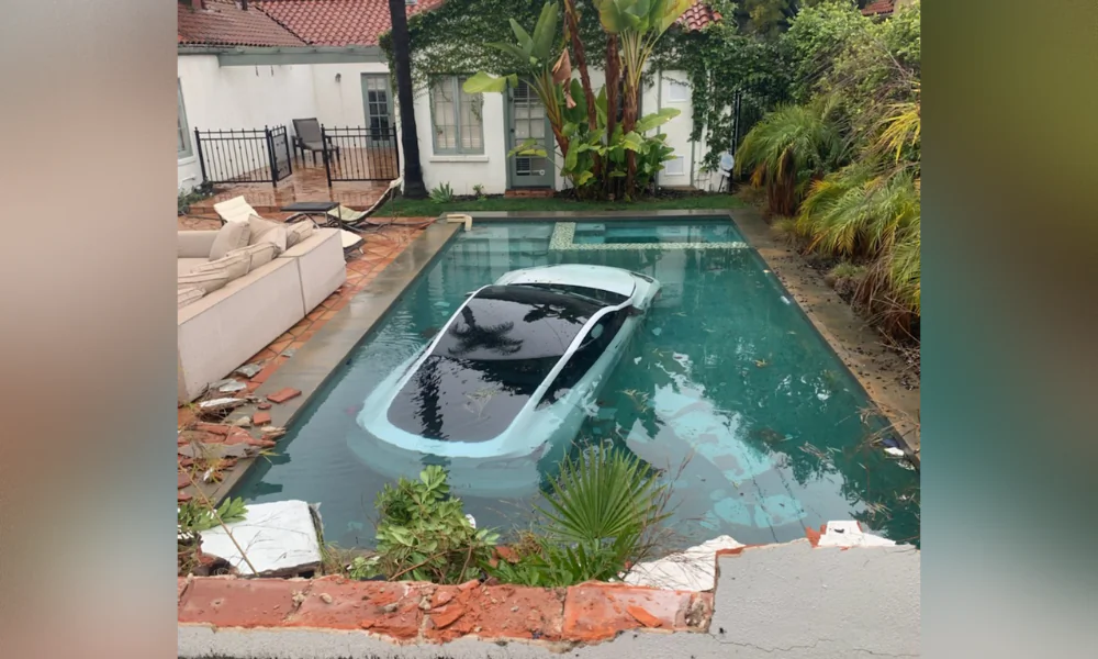 A Tesla driver hit the accelerator instead of the brake, drove through a wall and into a pool in Pasadena, Calif., on Jan. 10, 2023. (Courtesy of the Pasadena Fire Department)